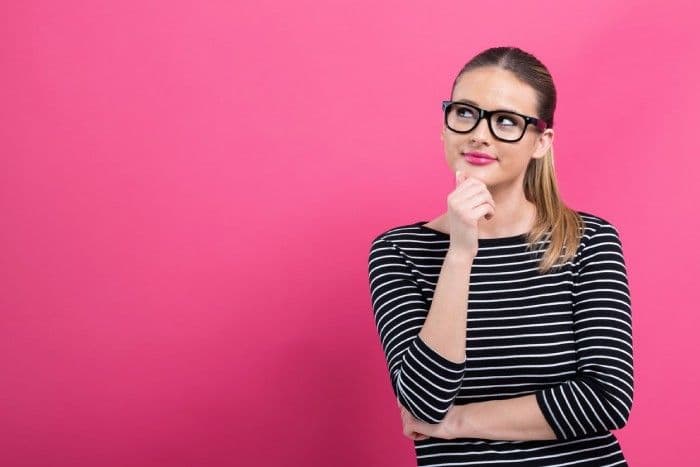 person with glasses thinking